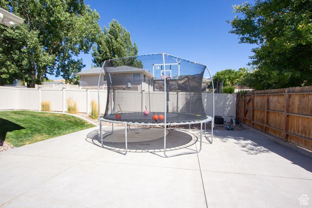 View of patio with a trampoline