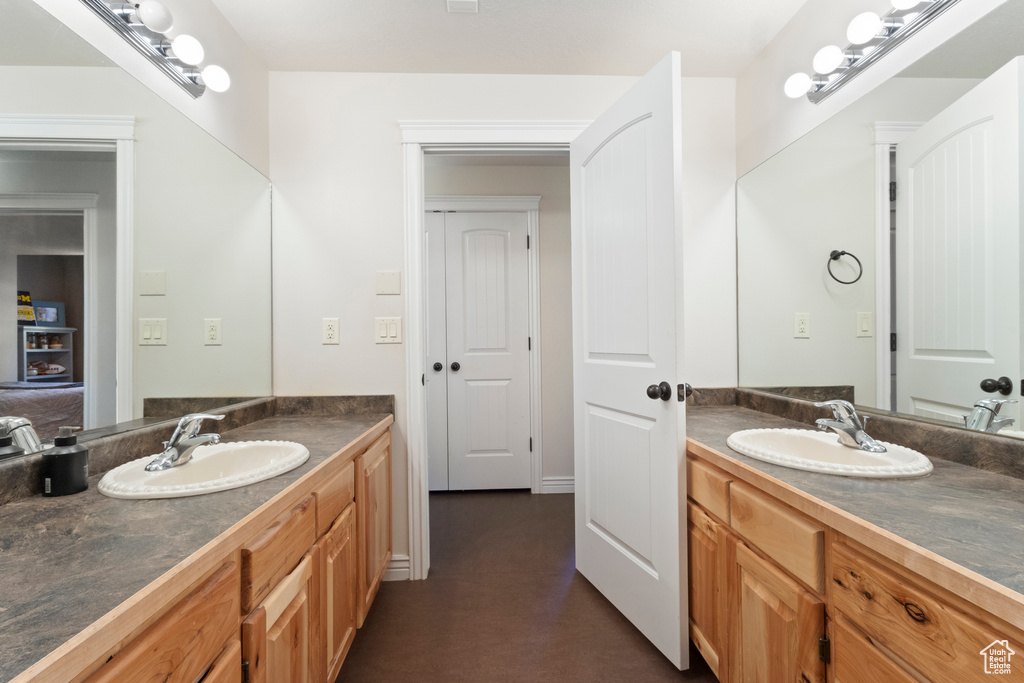 Bathroom with two vanities and a sink