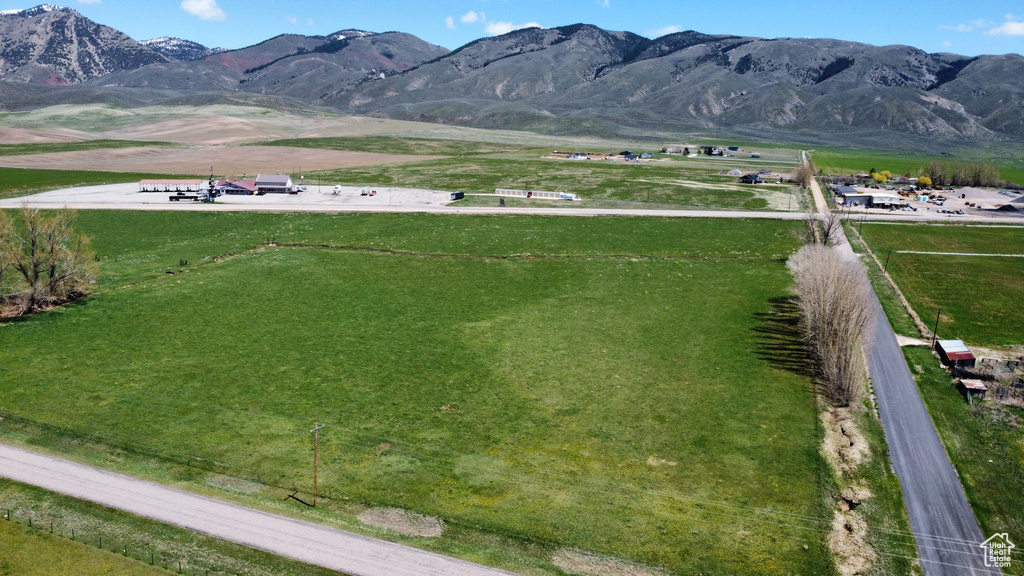 View of mountain backdrop featuring rural landscape