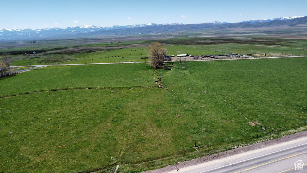 Aerial view of sparsely populated area featuring mountains and a pastoral area