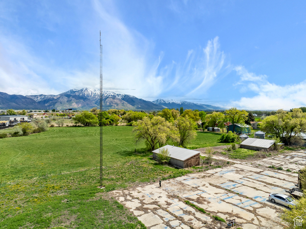 Exterior space with a mountain view and an outdoor structure