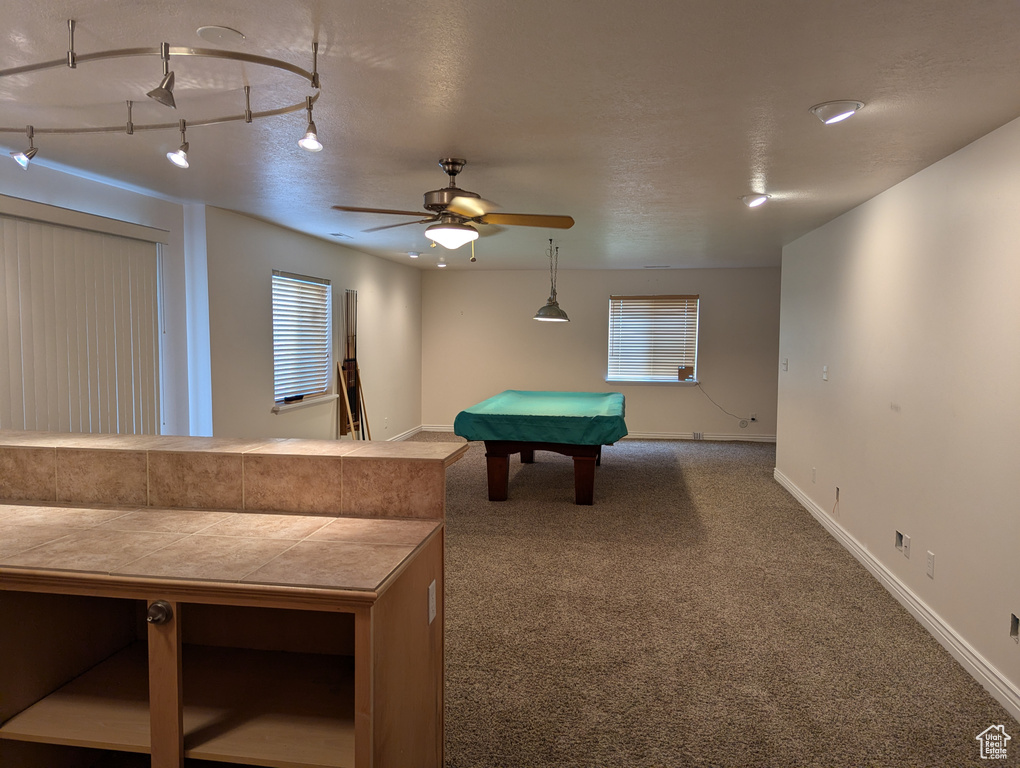Rec room with baseboards, carpet floors, ceiling fan, and pool table