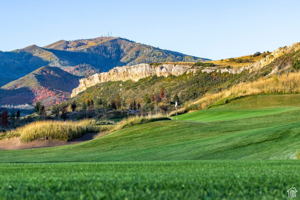 Property view of mountains with golf course view