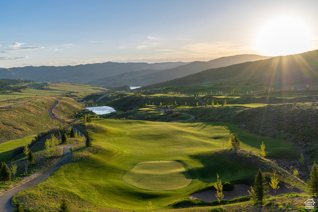 View of home's community with golf course view and a mountain view