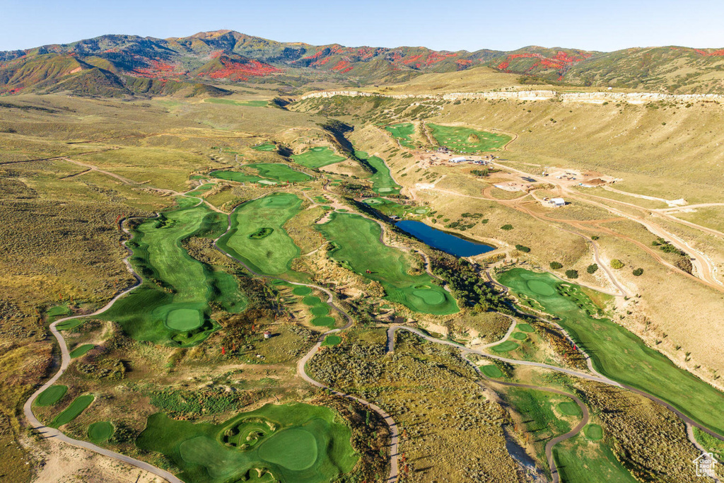 Birds eye view of property featuring a mountain view and view of golf course