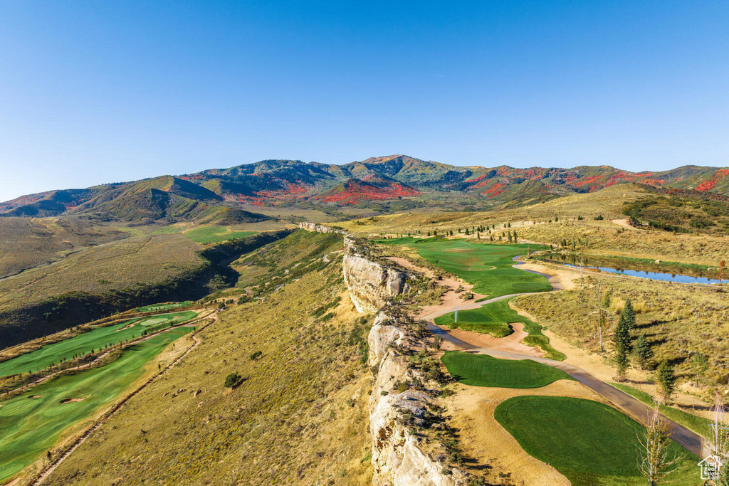 Mountain view featuring a water view and view of golf course