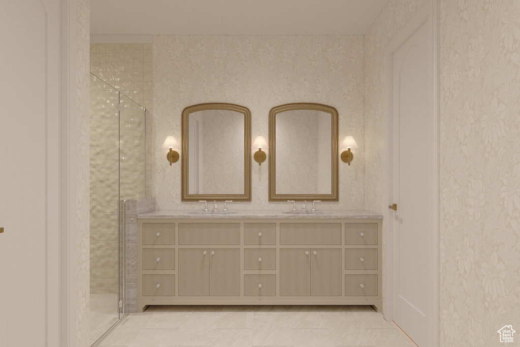 Full bathroom featuring a shower stall, double vanity, and a sink