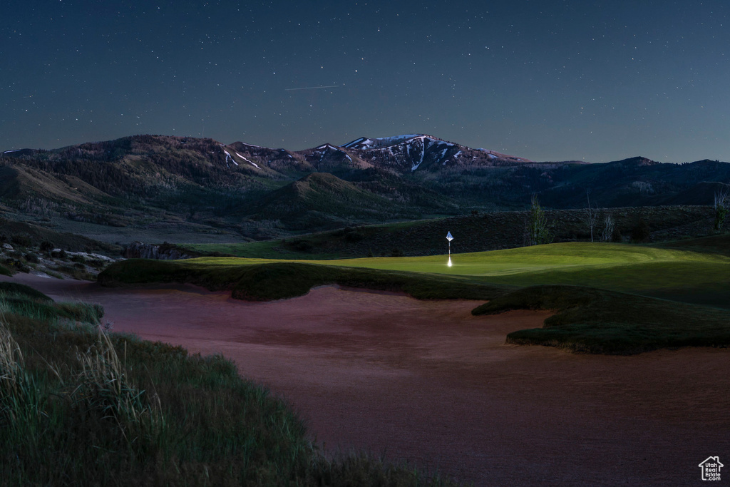 View of home's community with golf course view and a mountain view