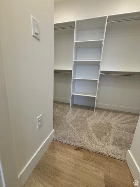 Spacious closet featuring wood finished floors