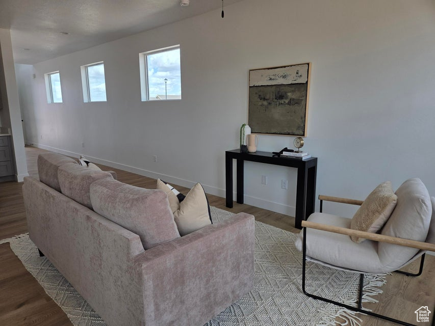 Living room with baseboards and wood finished floors