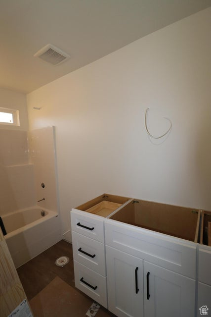 Bathroom featuring visible vents and wood finished floors