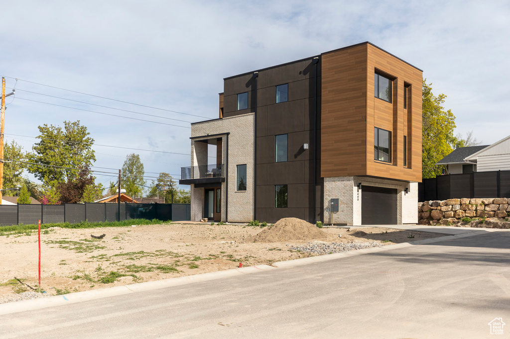 Contemporary home with driveway and a garage