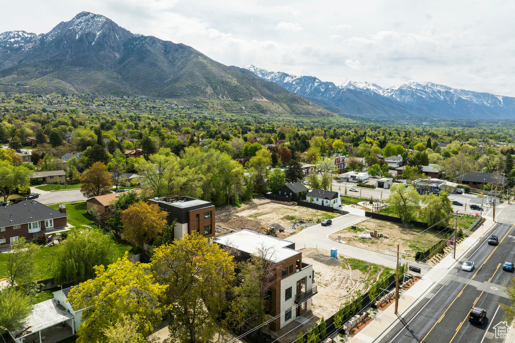 Birds eye view of property with a mountain view
