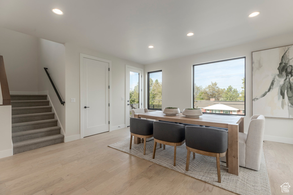 Dining space featuring light wood-type flooring, baseboards, and recessed lighting