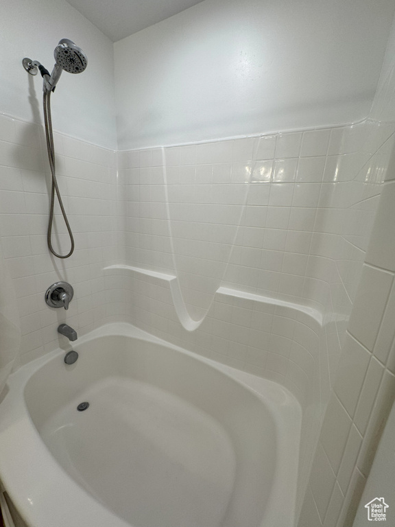 Full bathroom with shower / bathtub combination