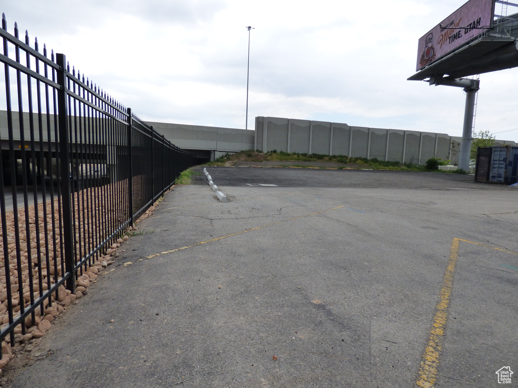 Uncovered parking lot with fence