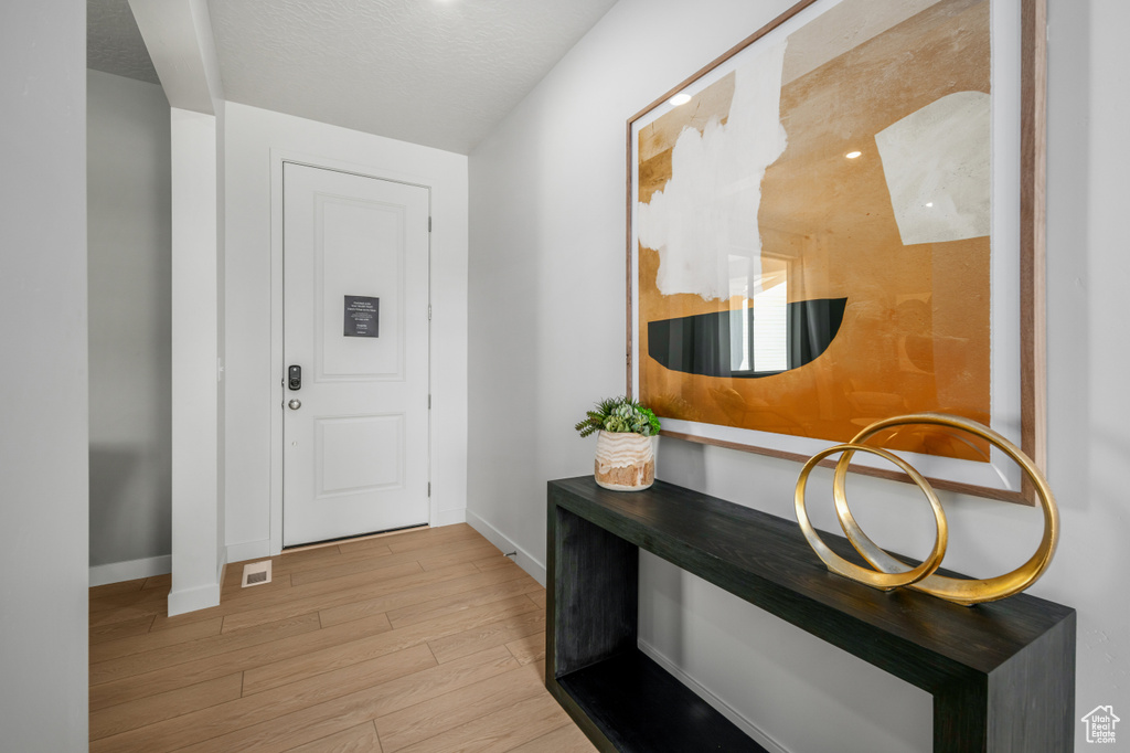 Interior space with wood finished floors and baseboards