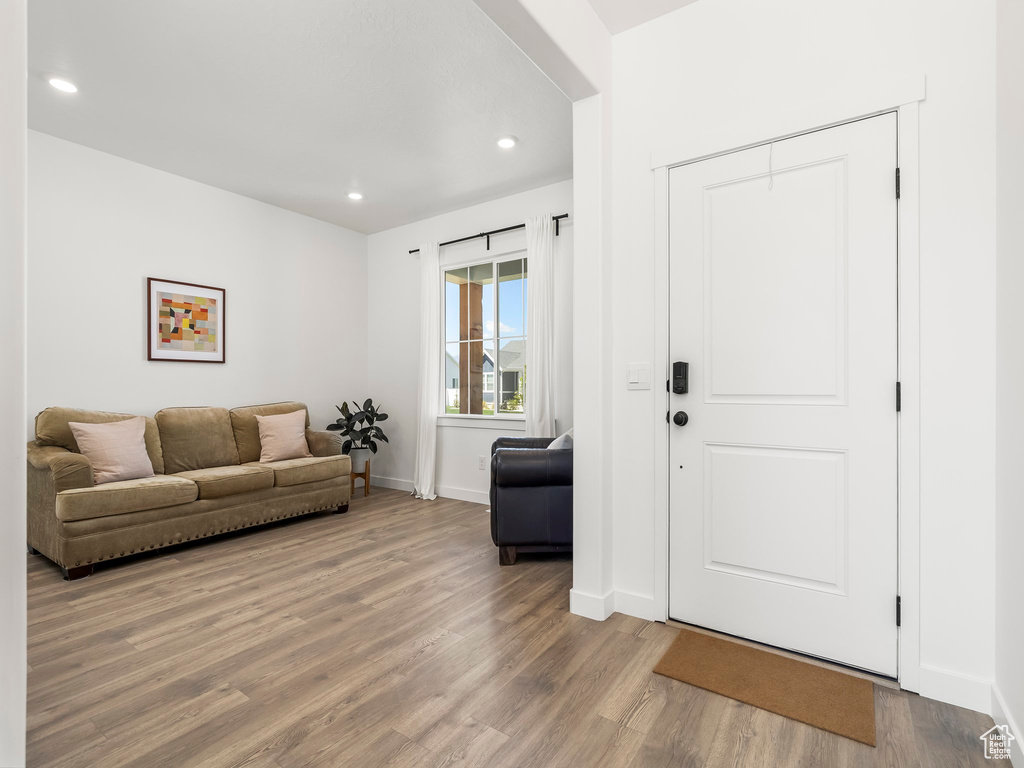 Interior space with recessed lighting, baseboards, and wood finished floors