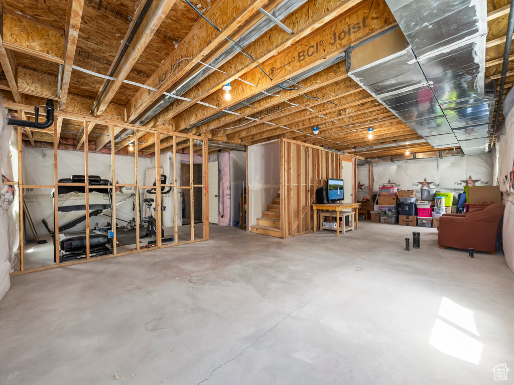 Unfinished basement with stairs