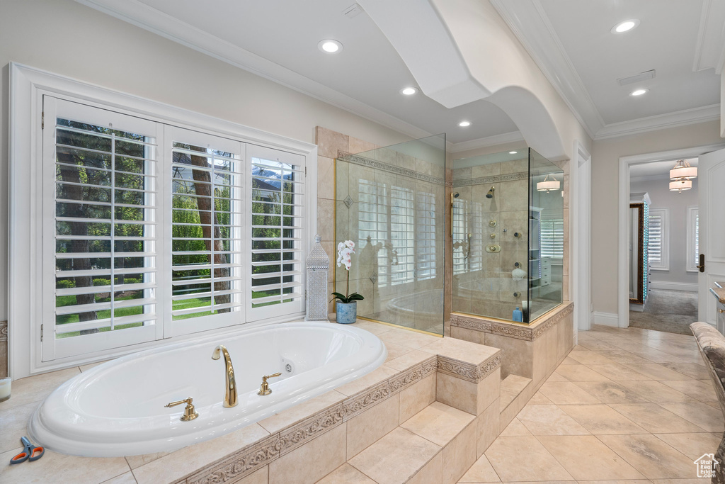 Full bath with a stall shower, crown molding, tile patterned floors, a bath, and recessed lighting