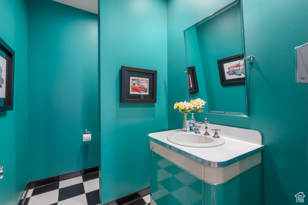 Bathroom featuring vanity and tile patterned floors