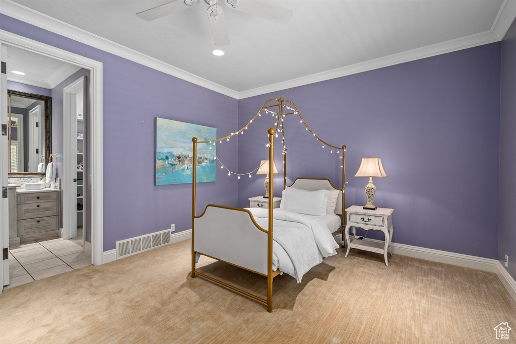 Bedroom with a ceiling fan, carpet, baseboards, ornamental molding, and visible vents