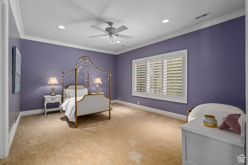 Bedroom featuring baseboards, recessed lighting, crown molding, and visible vents