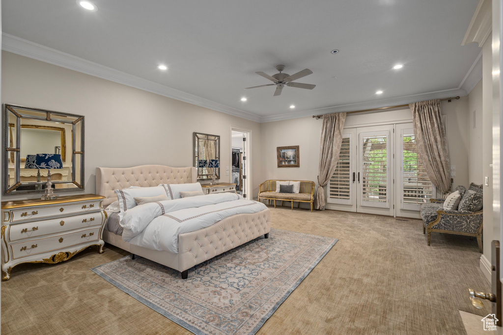 Bedroom with crown molding, carpet, and access to exterior