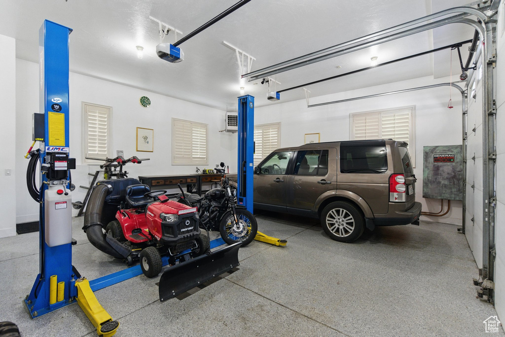 Garage featuring a garage door opener