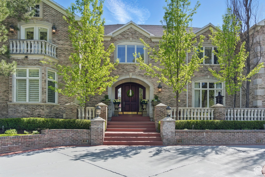 View of front of home featuring french doors and brick siding