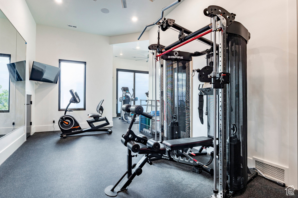 Workout area with baseboards and recessed lighting