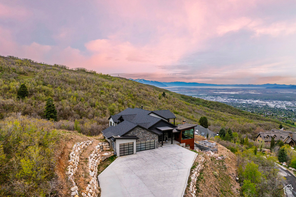 Birds eye view of property with a mountain view