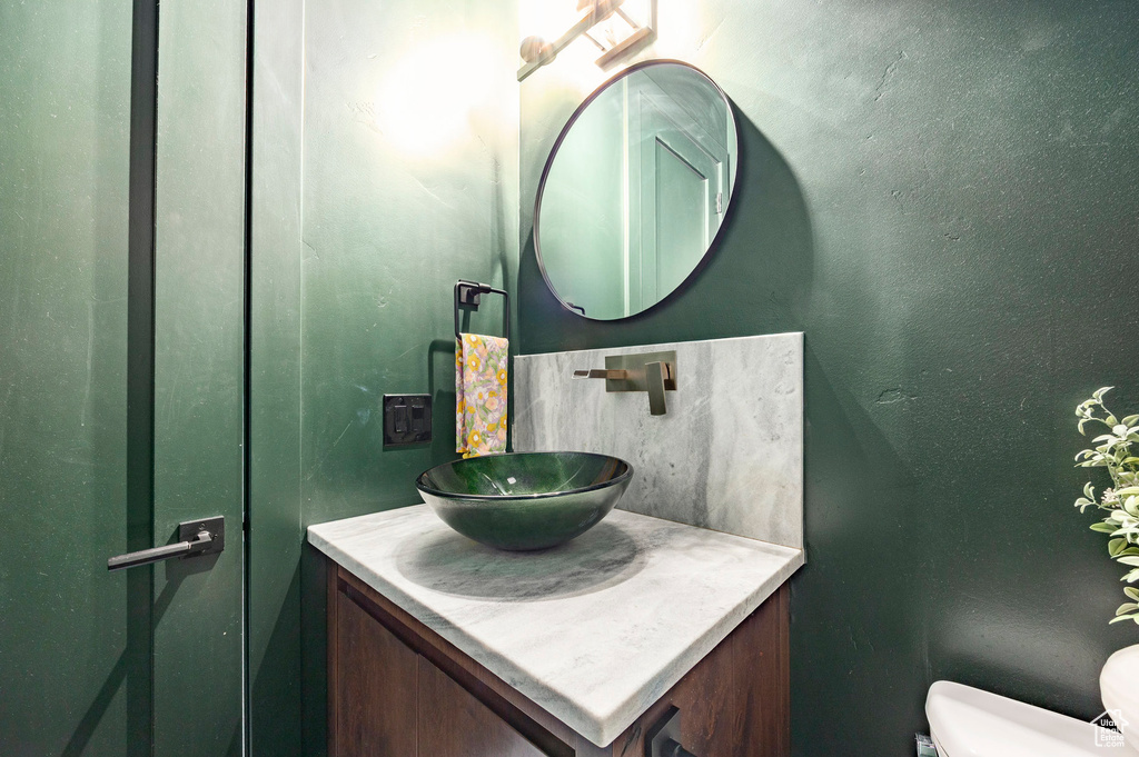 Bathroom featuring toilet and vanity