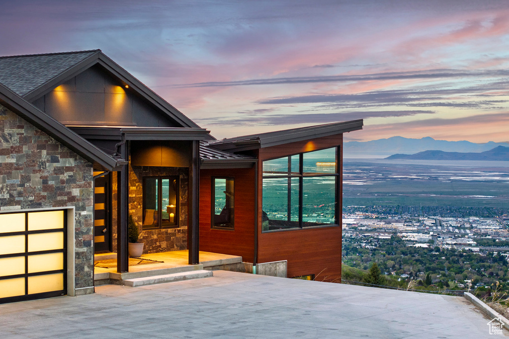 Exterior space featuring stone siding and a mountain view