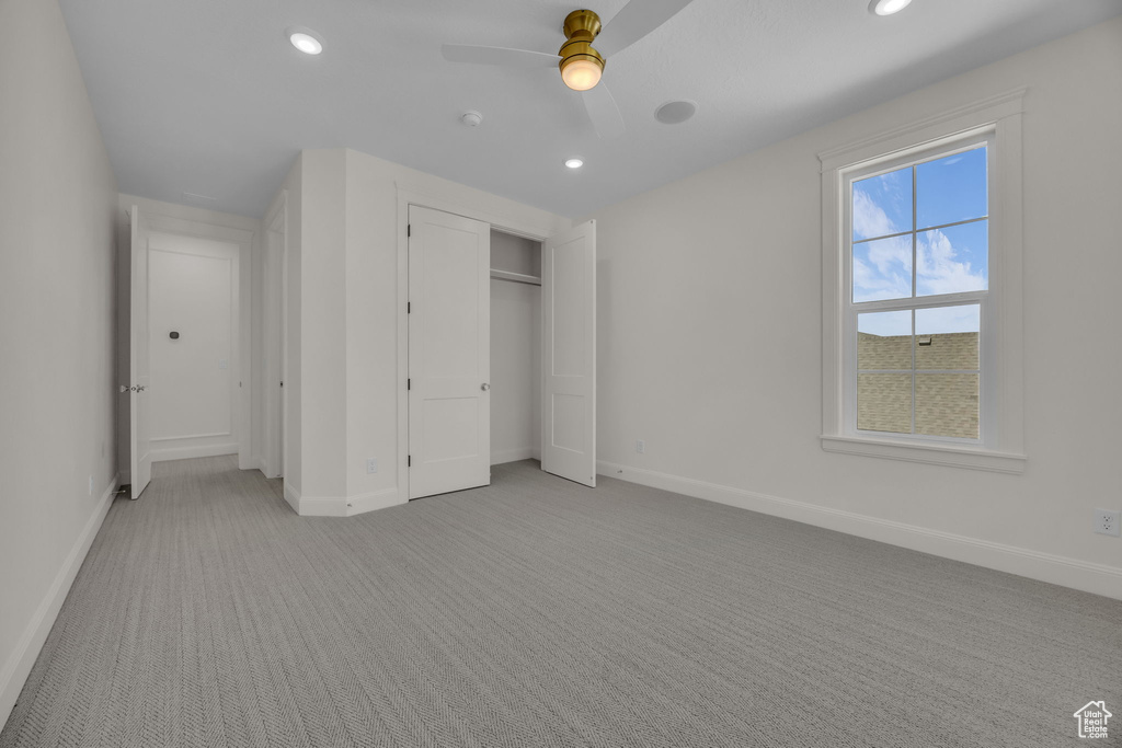 Unfurnished bedroom featuring baseboards, recessed lighting, and light colored carpet