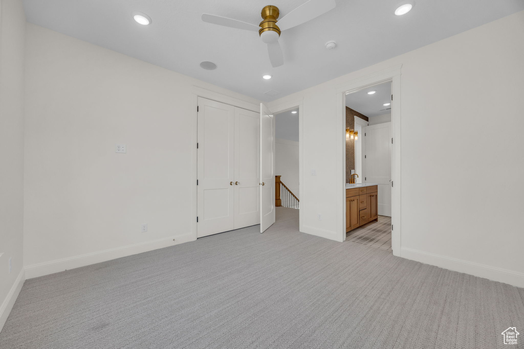 Unfurnished room featuring light carpet, baseboards, ceiling fan, and recessed lighting