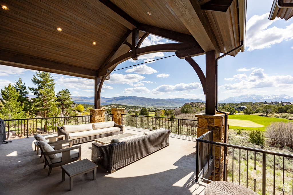 View of patio with a mountain view and outdoor lounge area