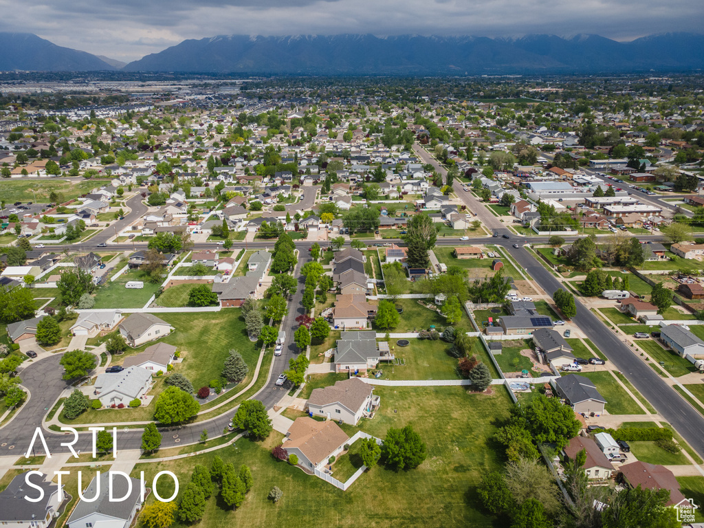 Birds eye view of property featuring a mountain view and a residential view