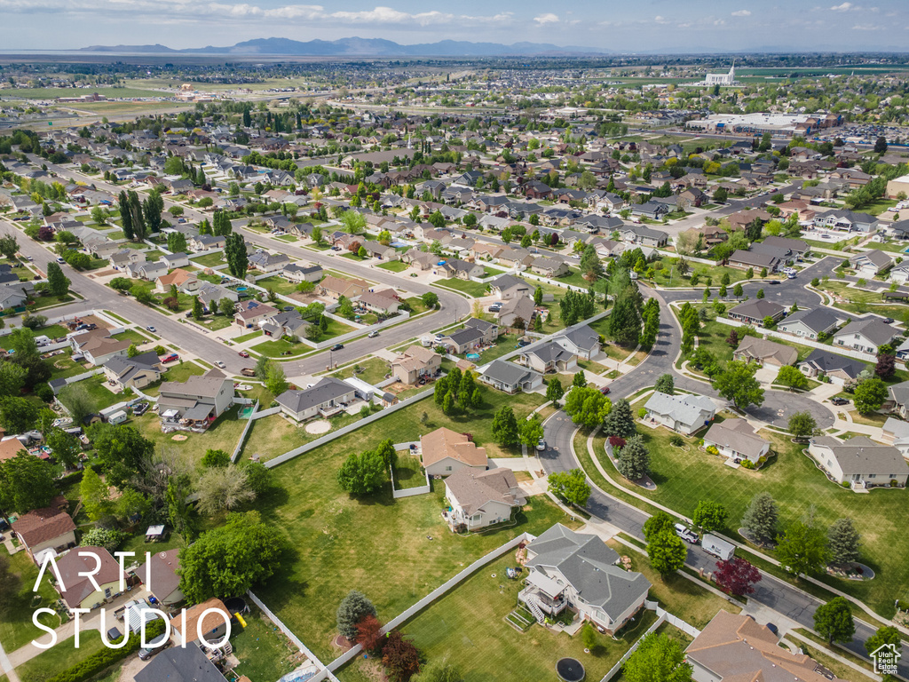 Birds eye view of property featuring a mountain view and a residential view