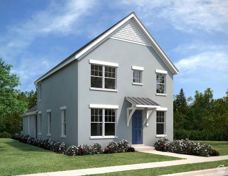 Modern farmhouse style home featuring a front lawn, stucco siding, and a standing seam roof