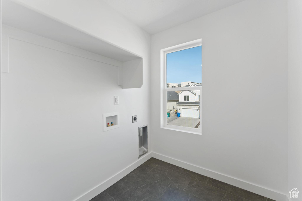 Laundry area with laundry area, washer hookup, baseboards, and hookup for an electric dryer