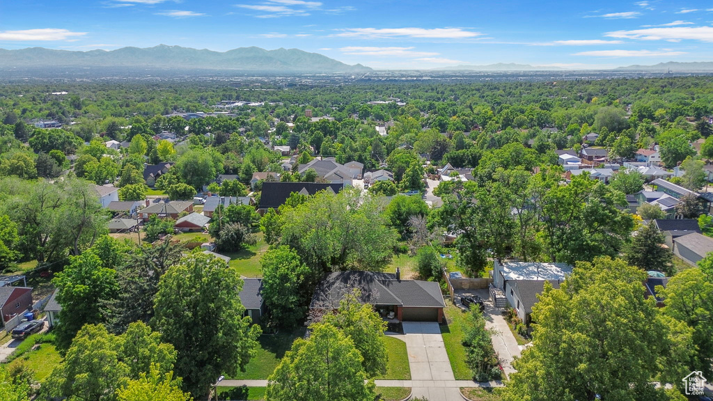 Aerial perspective of suburban area featuring a mountainous background