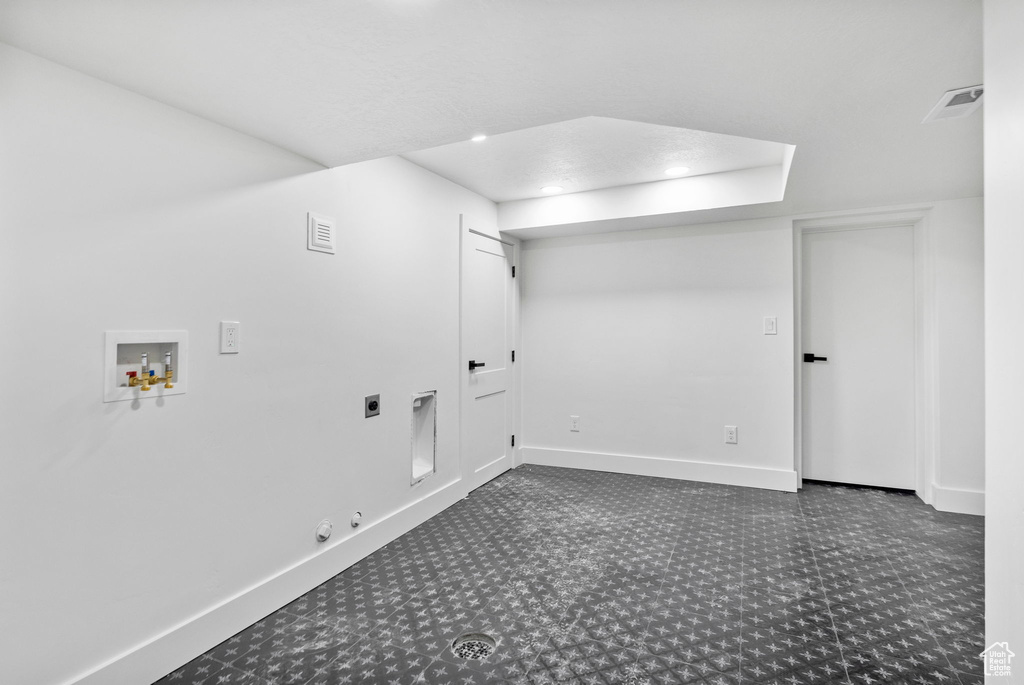 Washroom featuring hookup for an electric dryer, baseboards, hookup for a washing machine, and gas dryer hookup
