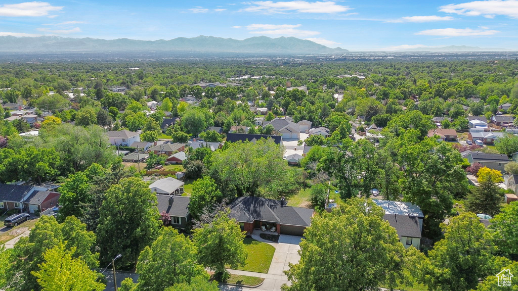 Aerial view of residential area featuring mountains