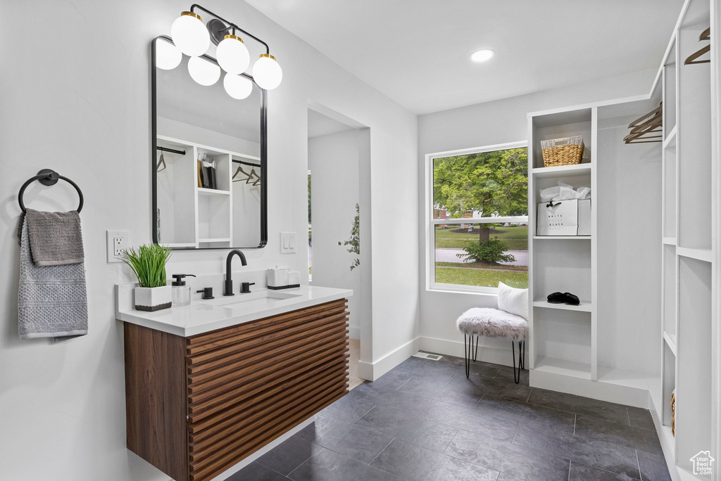 Full bathroom featuring baseboards and vanity