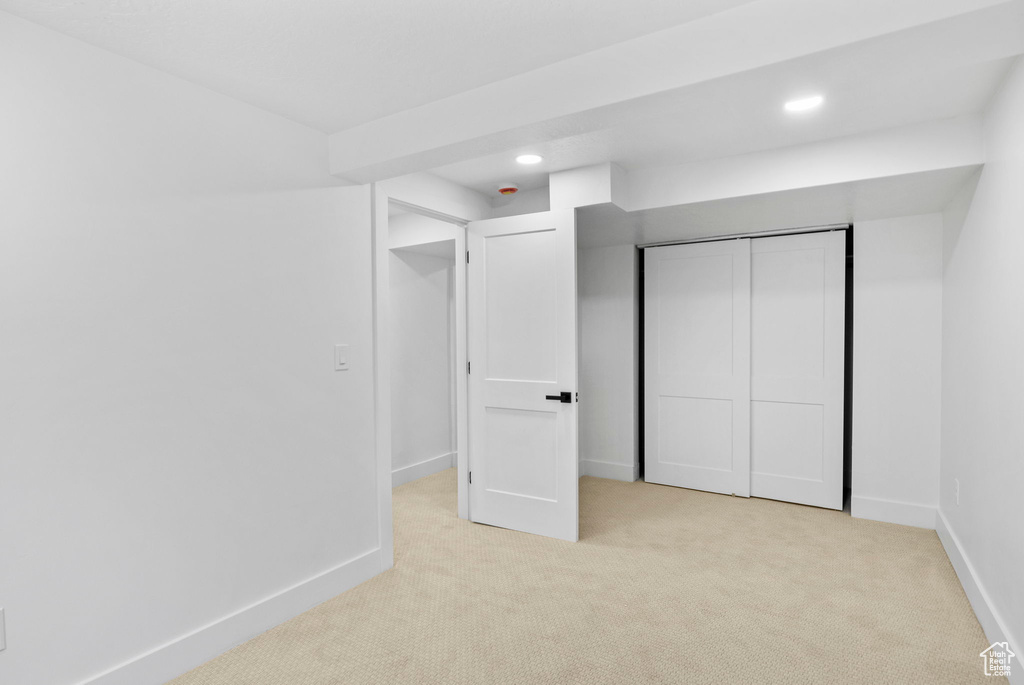 Unfurnished bedroom featuring recessed lighting, baseboards, and carpet floors