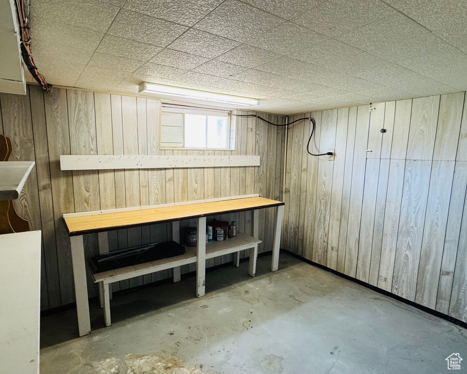 Below grade area with wood walls