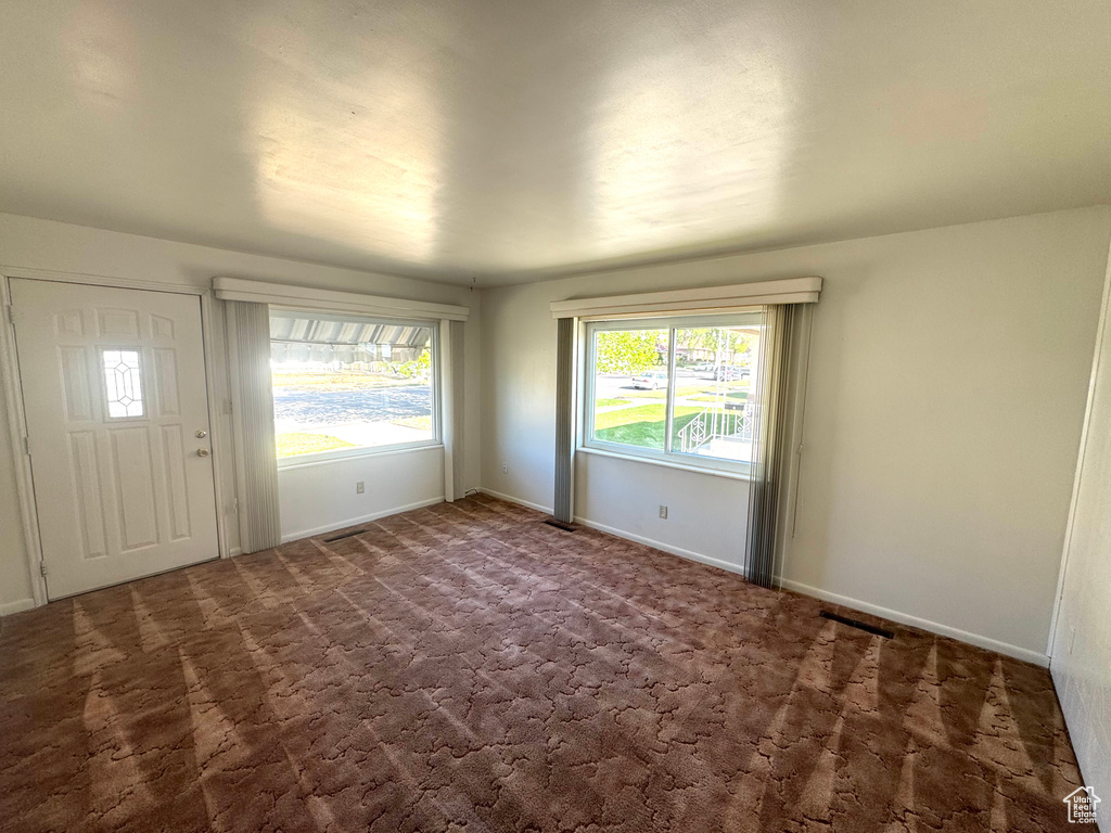 Interior space featuring baseboards and visible vents