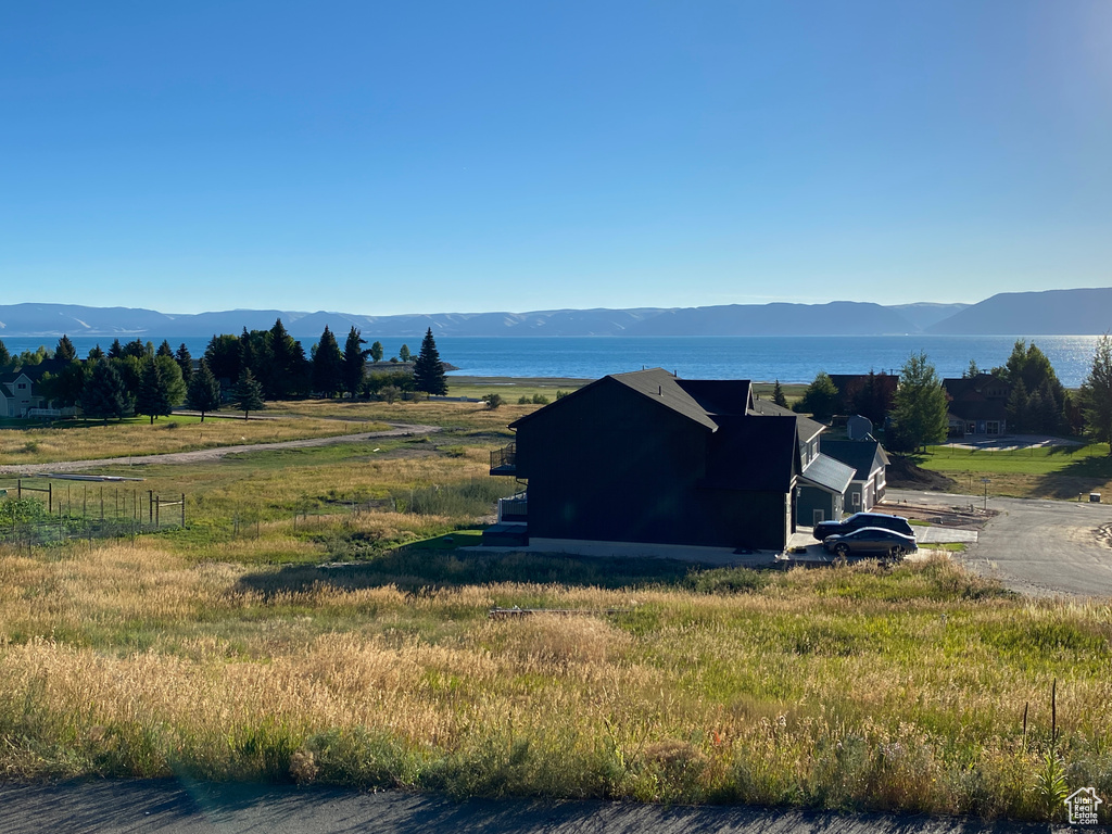 Property view of mountains with a water view