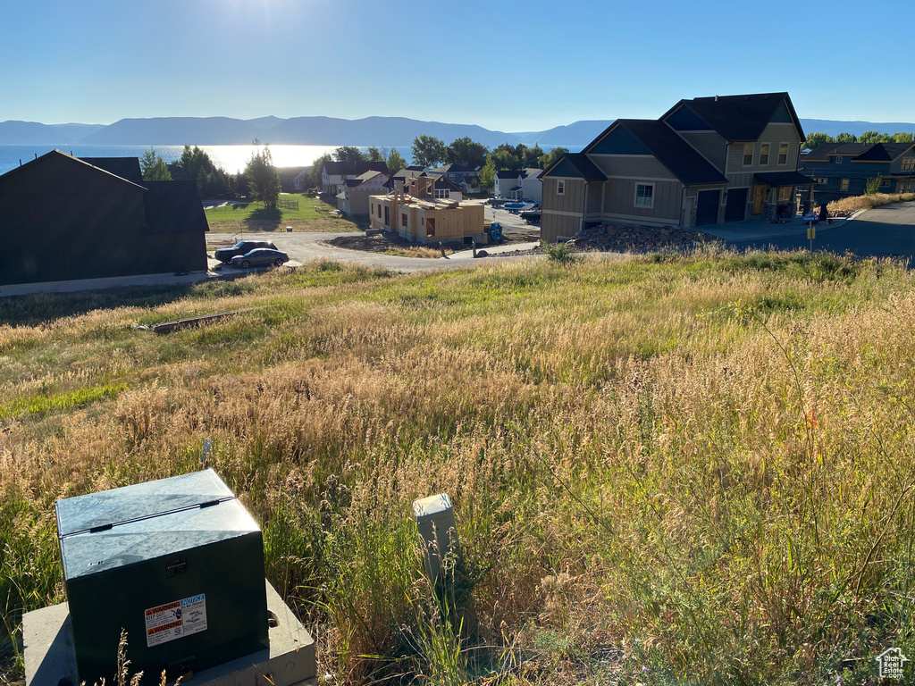 View of yard featuring a residential view and a mountain view
